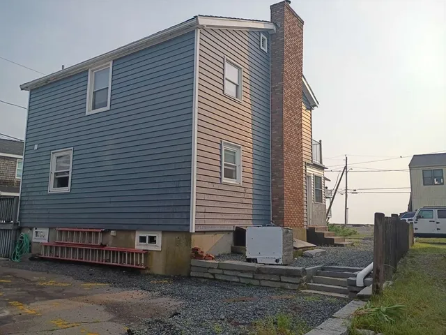 a front view of a house with large windows