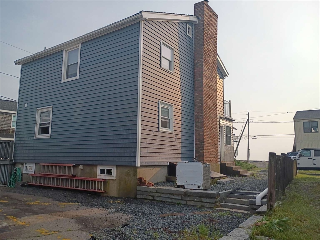 6 Tilden Avenue Scituate, MA 02066 - Photo 4 of 34 a front view of a house with large windows