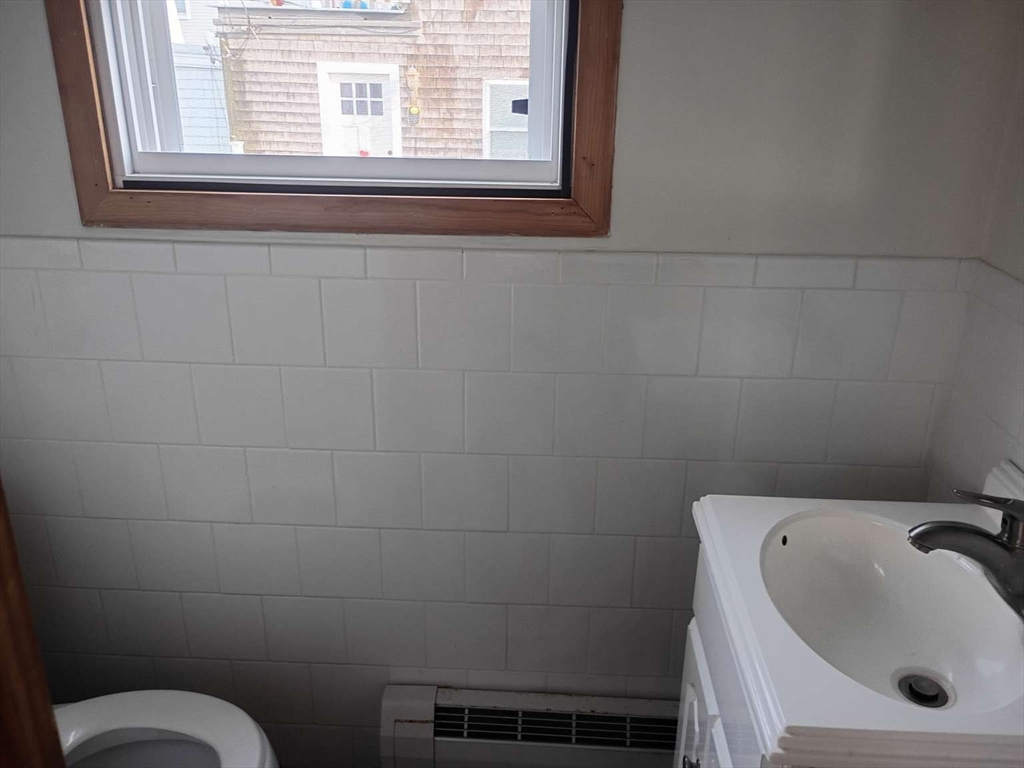 6 Tilden Avenue Scituate, MA 02066 - Photo 10 of 34 a bathroom with a sink and a toilet