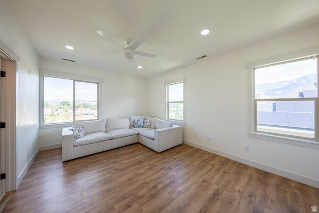868 Braddock Lane Alpine, UT 84004 - Photo 28 of 64 Spacious room featuring wood-finish flooring, ample natural light from multiple windows, recessed lighting, and a ceiling fan