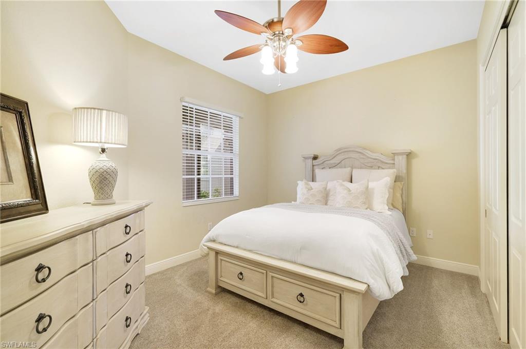 19741 Marino Lake Circle, Unit 802 Miromar Lakes, FL 33913 - Photo 15 of 38 a bedroom with a bed and a window