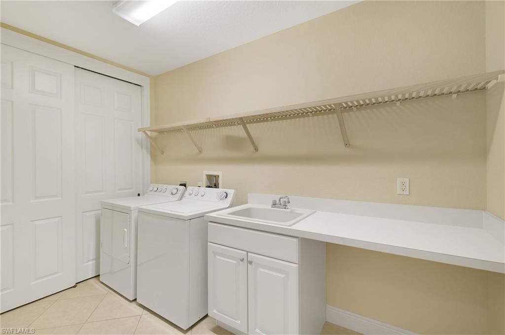 19741 Marino Lake Circle, Unit 802 Miromar Lakes, FL 33913 - Photo 20 of 38 a utility room with dryer and washer