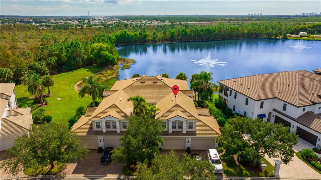 19741 Marino Lake Circle, Unit 802 Miromar Lakes, FL 33913 - Photo 22 of 38 an aerial view of a house with a lake view