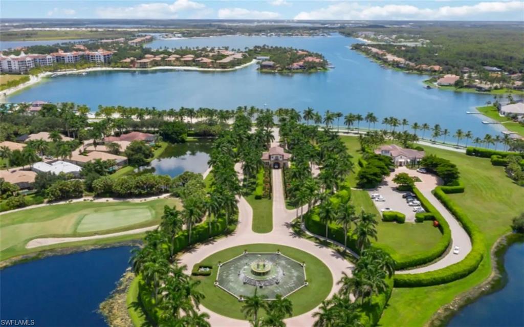19741 Marino Lake Circle, Unit 802 Miromar Lakes, FL 33913 - Photo 26 of 38 an aerial view of residential houses with outdoor space and river