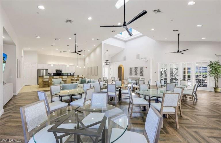 19741 Marino Lake Circle, Unit 802 Miromar Lakes, FL 33913 - Photo 30 of 38 a large kitchen with a table and chairs