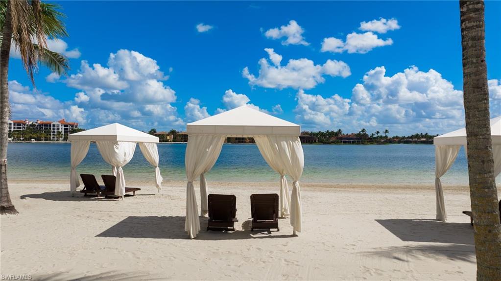 19741 Marino Lake Circle, Unit 802 Miromar Lakes, FL 33913 - Photo 36 of 38 a front view of a house with entertaining space