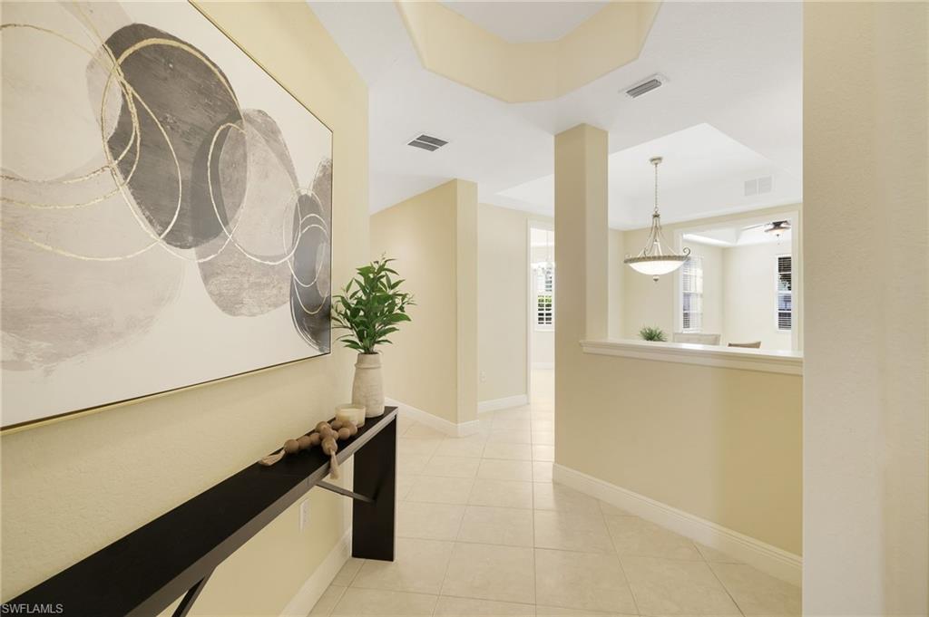 19741 Marino Lake Circle, Unit 802 Miromar Lakes, FL 33913 - Photo 6 of 38 a view of a bathroom with a sink and mirror