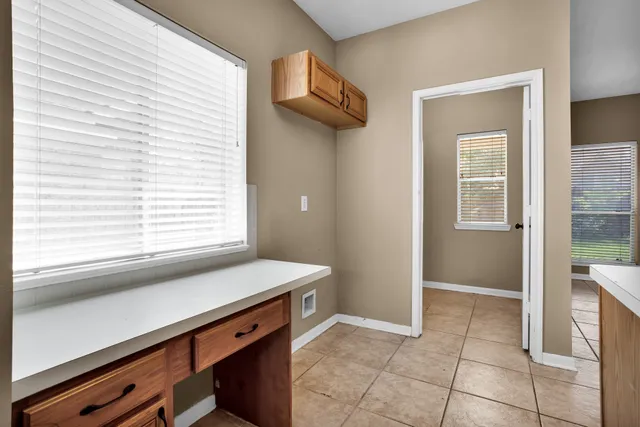 a view of bathroom with a sink and a window