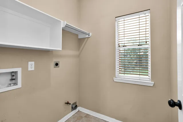 a view of a hallway that has a window in it