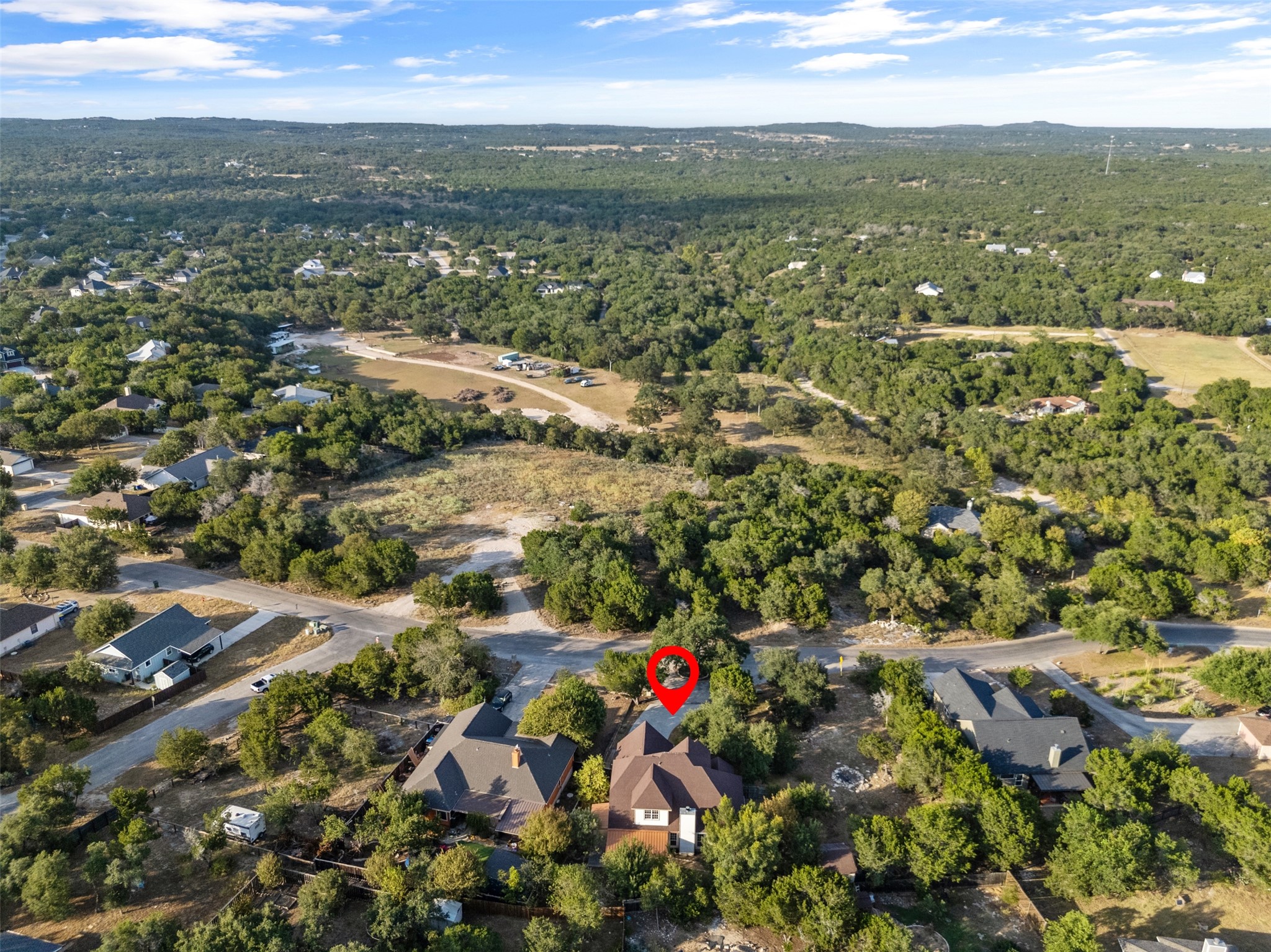 72 Crazy Cross Road Wimberley, TX 78676 - Photo 6 of 35 Mature trees envelope the home in a peaceful neighborhood setting.