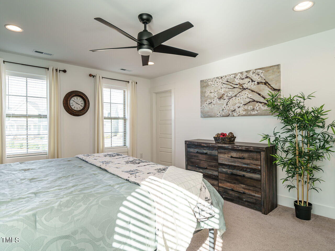 277 Daniel Ridge Road Wendell, NC 27591 - Photo 19 of 32 a bedroom with a bed and a window