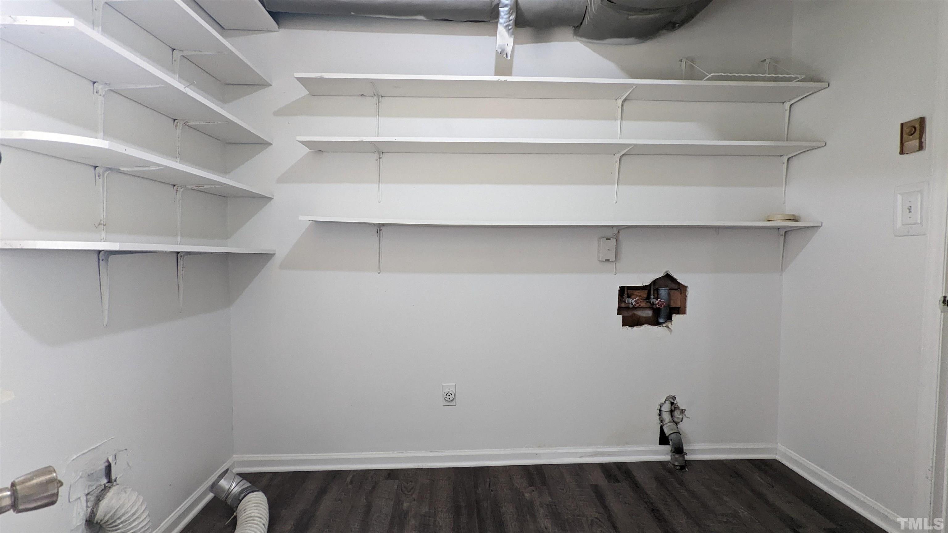 4901 Vallery Place Raleigh, NC 27604 - Photo 13 of 22 a view of a closet with racks on the wall