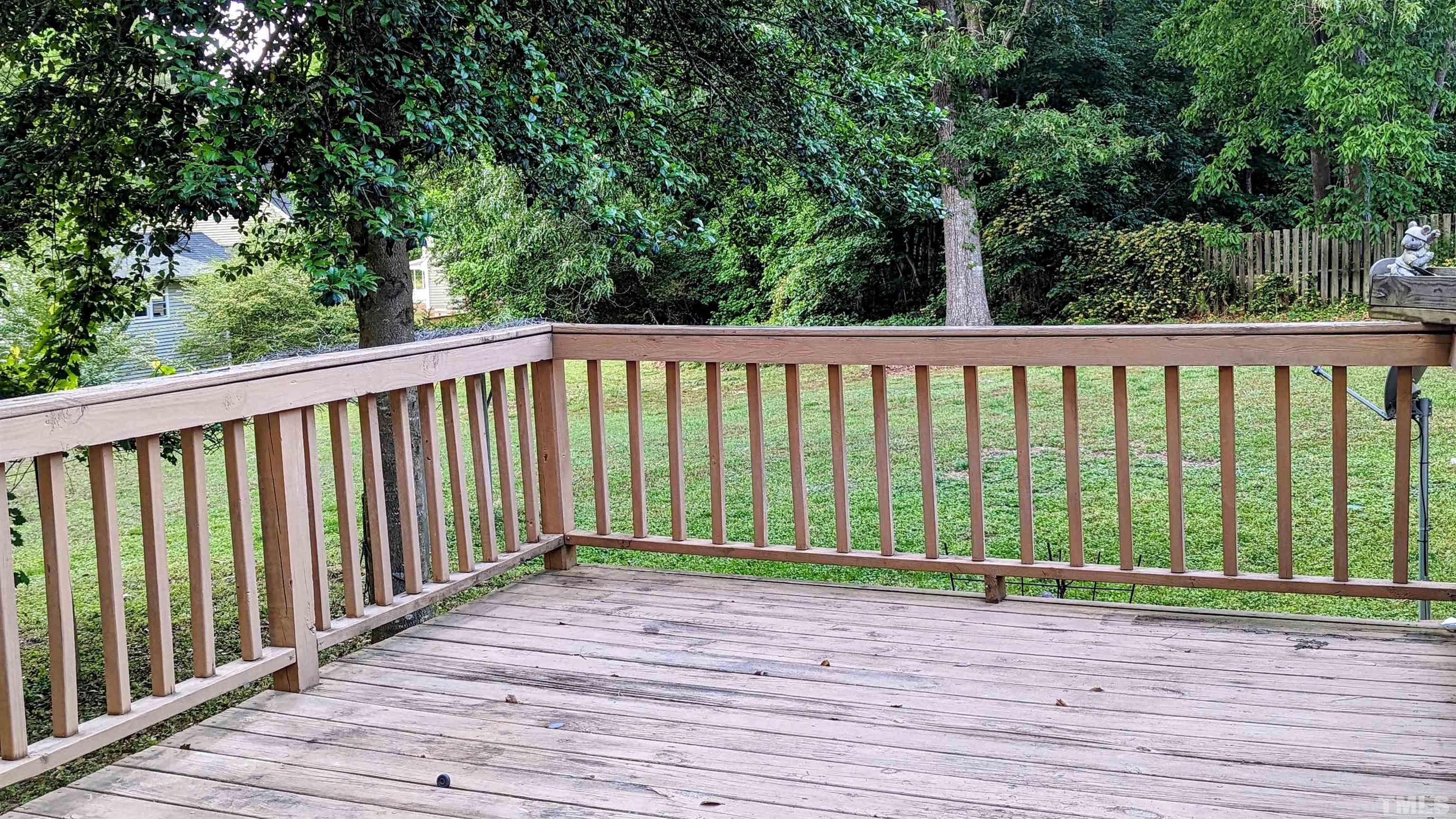 4901 Vallery Place Raleigh, NC 27604 - Photo 15 of 22 a view of a wooden deck