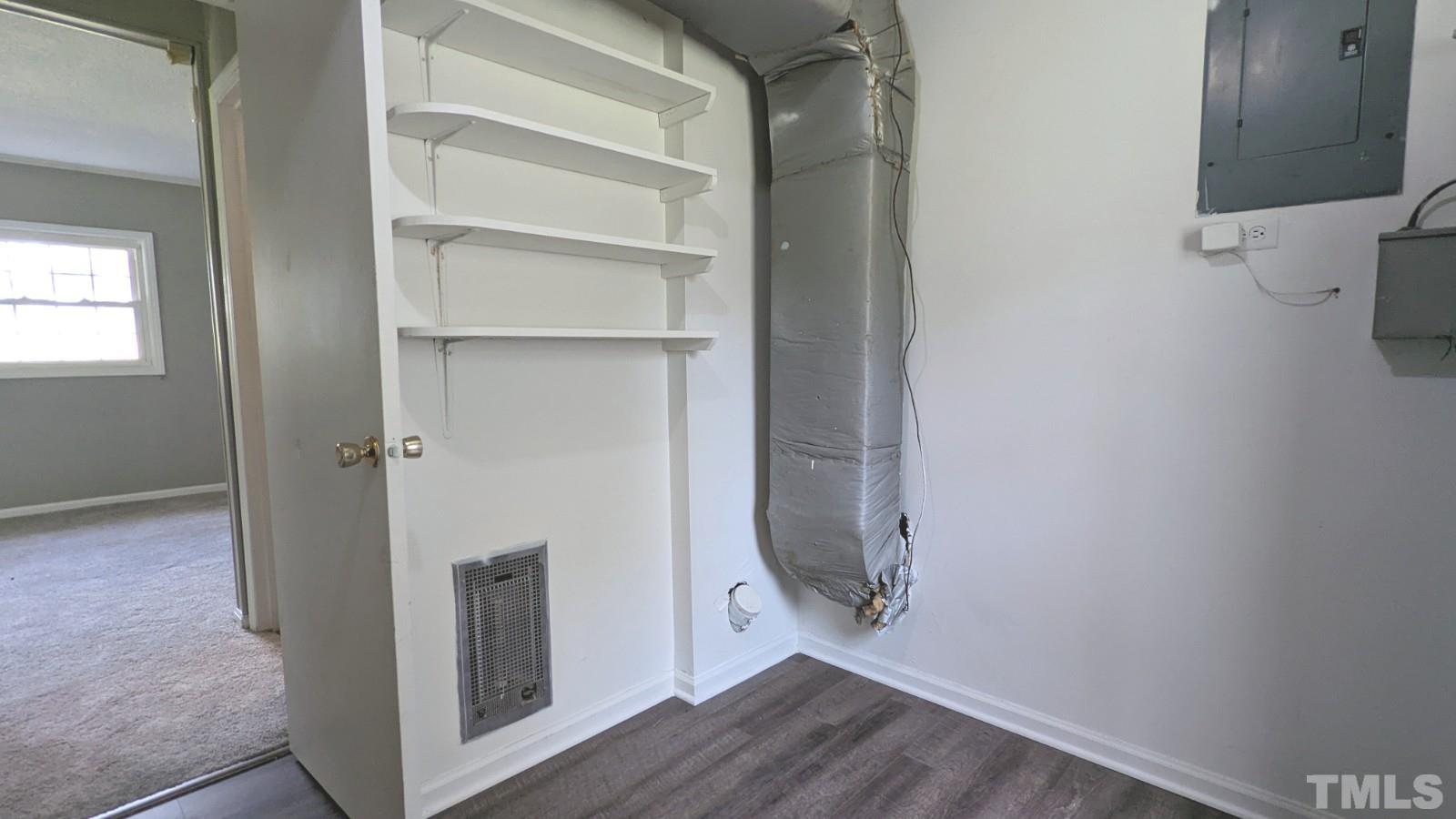4901 Vallery Place Raleigh, NC 27604 - Photo 20 of 22 a view of a hallway with wooden floor and closet