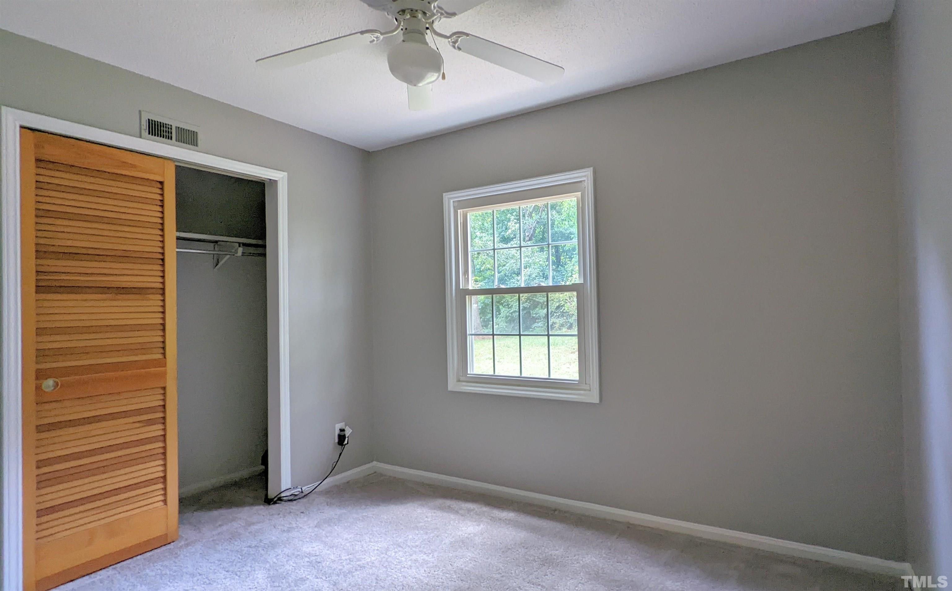 4901 Vallery Place Raleigh, NC 27604 - Photo 8 of 22 a view of an empty room with a window