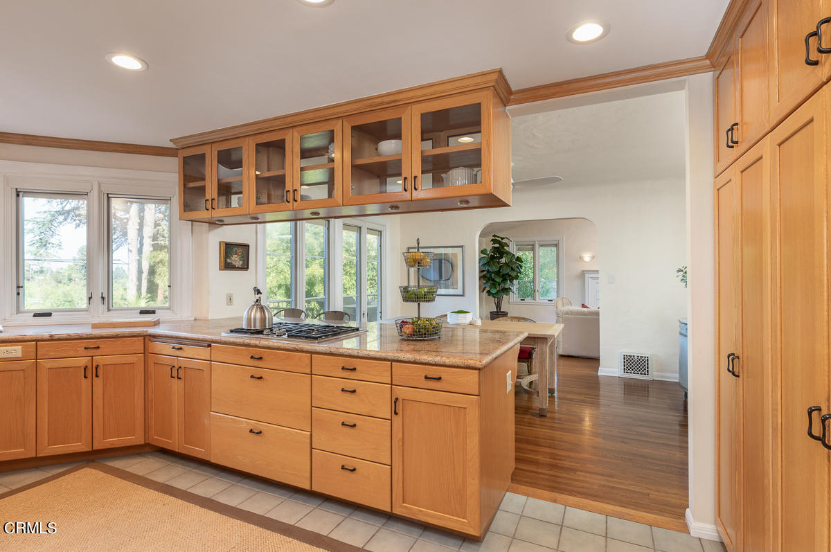 1659 Kaweah Drive Pasadena, CA 91105 - Photo 18 of 46 a dining hall with stainless steel appliances granite countertop a sink and cabinets