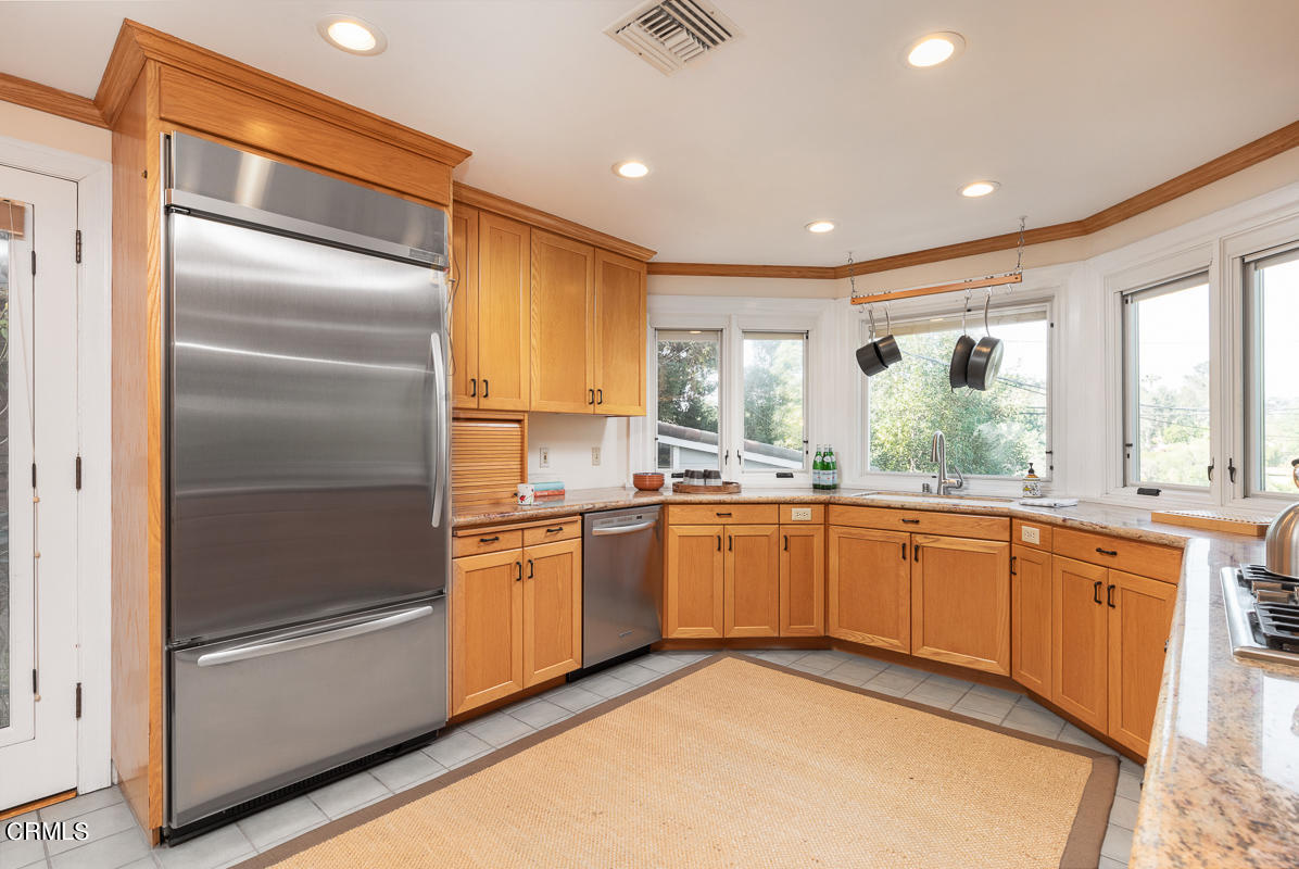 1659 Kaweah Drive Pasadena, CA 91105 - Photo 19 of 46 a large kitchen with granite countertop stainless steel appliances lots of counter top space
