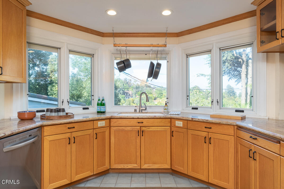 1659 Kaweah Drive Pasadena, CA 91105 - Photo 20 of 46 a kitchen with sink cabinets and wooden floor
