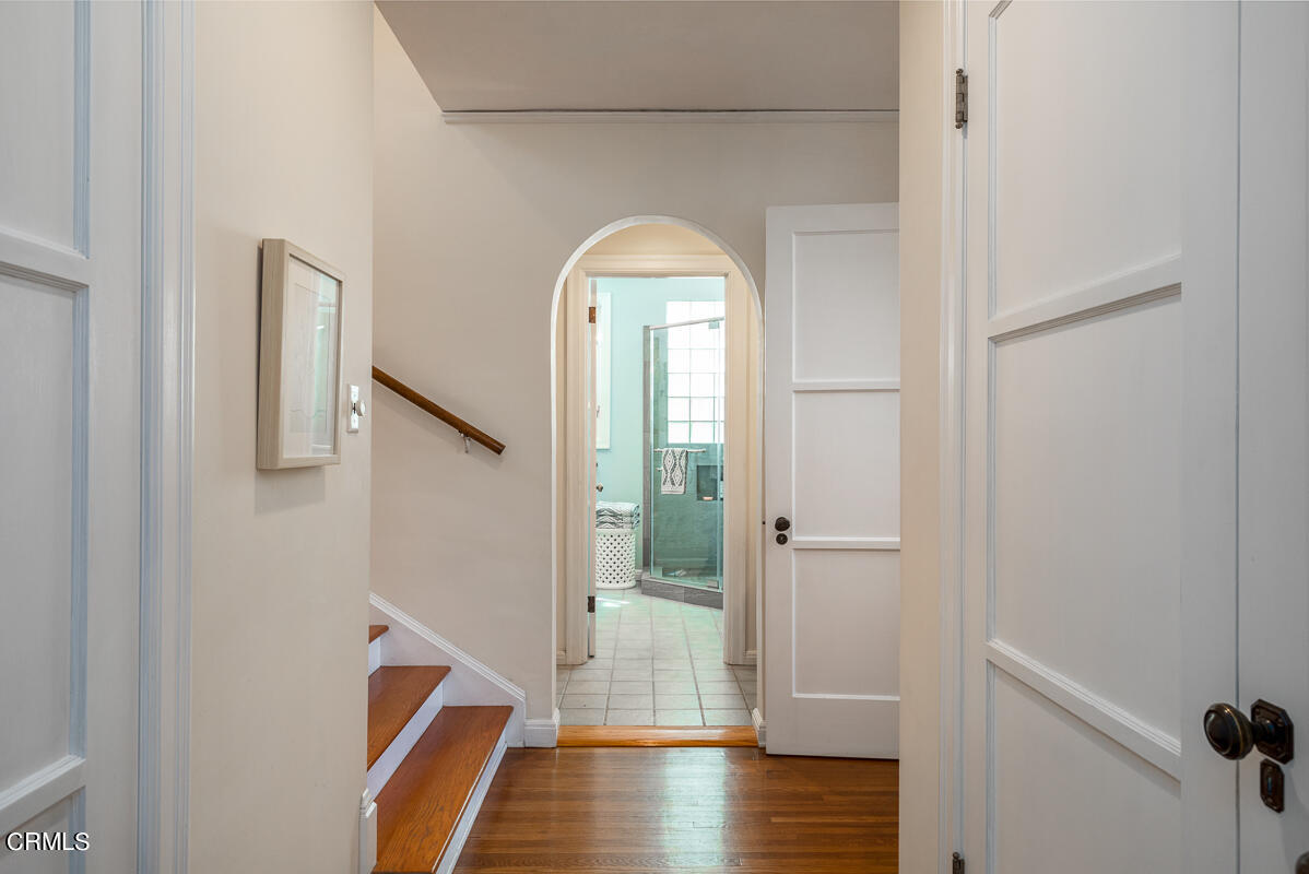 1659 Kaweah Drive Pasadena, CA 91105 - Photo 23 of 46 a view of a hallway with wooden floor and glass door