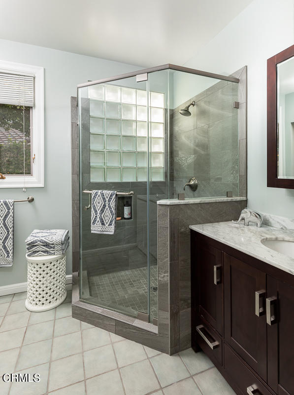 1659 Kaweah Drive Pasadena, CA 91105 - Photo 25 of 46 a bathroom with a double vanity sink mirror and shower