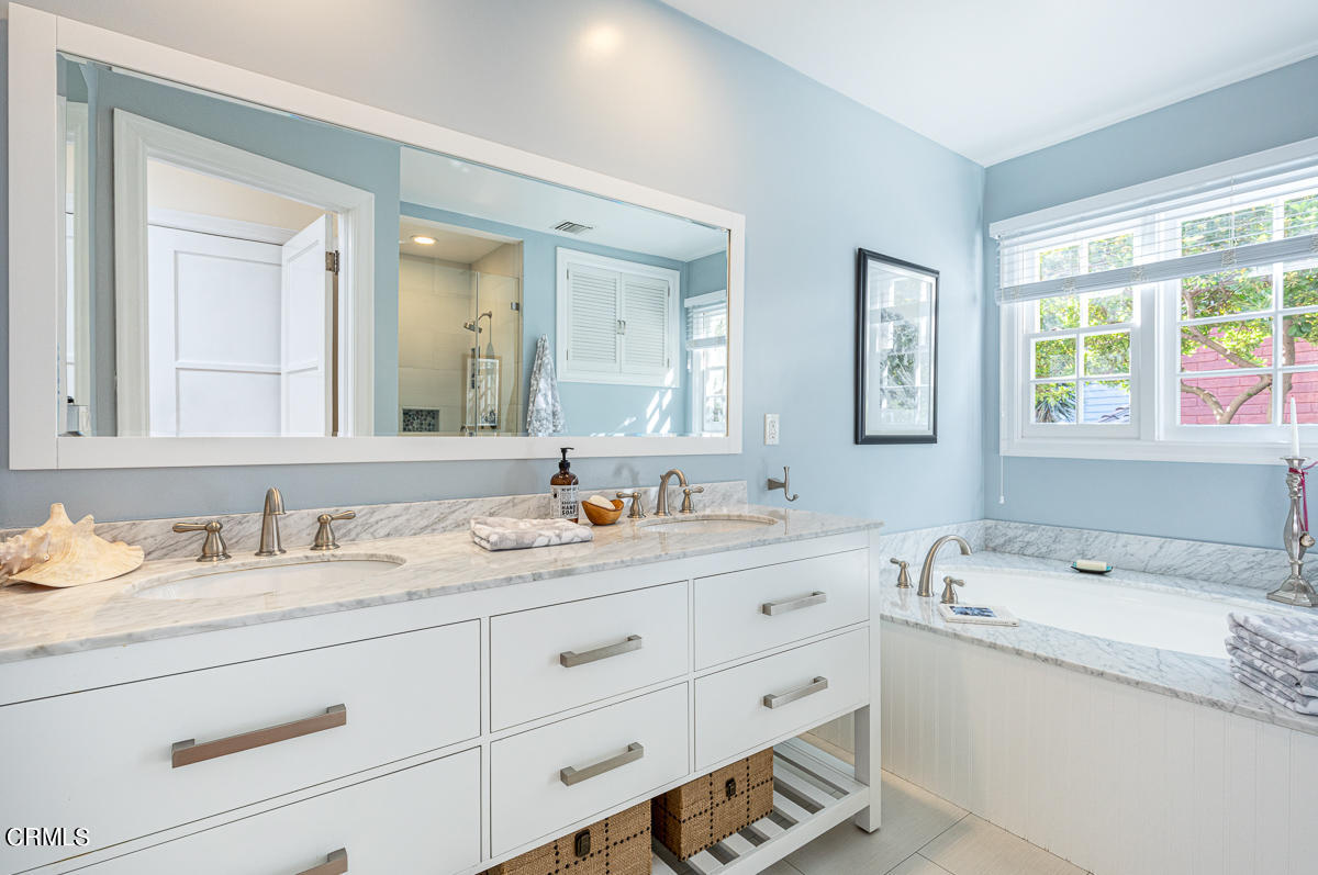 1659 Kaweah Drive Pasadena, CA 91105 - Photo 28 of 46 a bathroom with a granite countertop sink mirror and double