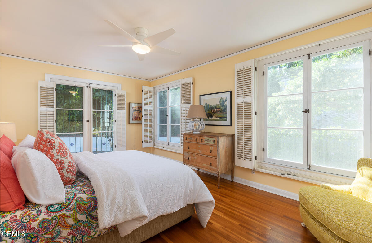 1659 Kaweah Drive Pasadena, CA 91105 - Photo 30 of 46 a bedroom with a bed large window with wooden floor