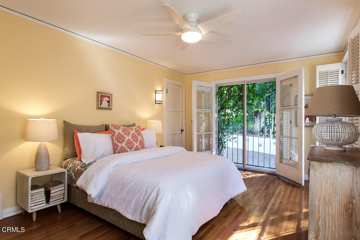 1659 Kaweah Drive Pasadena, CA 91105 - Photo 31 of 46 a bedroom with a bed and wooden floor