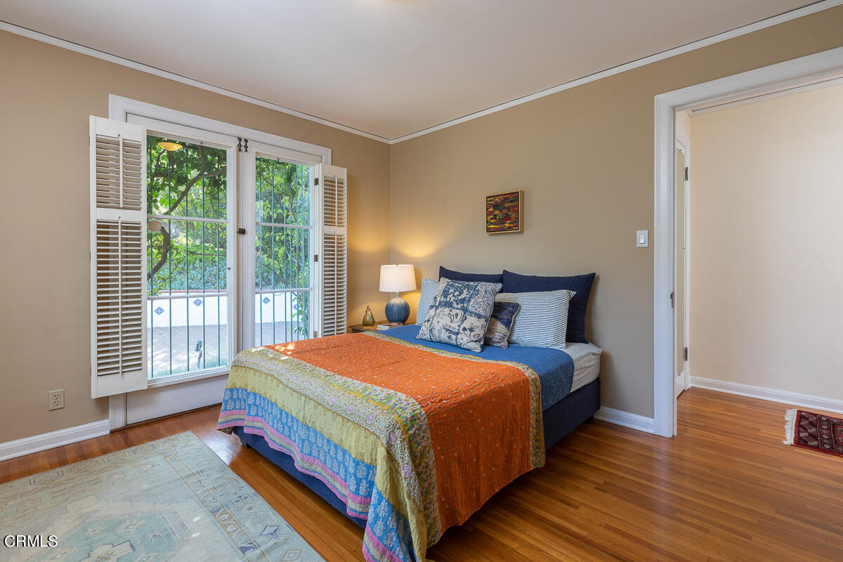 1659 Kaweah Drive Pasadena, CA 91105 - Photo 34 of 46 a bedroom with a bed and wooden floor