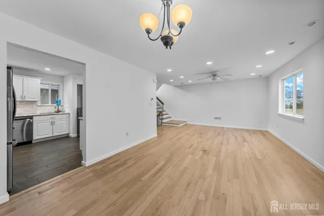 a view of a kitchen with a sink and a window