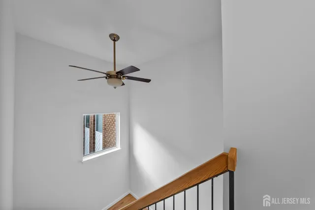 a view of a hallway with a window