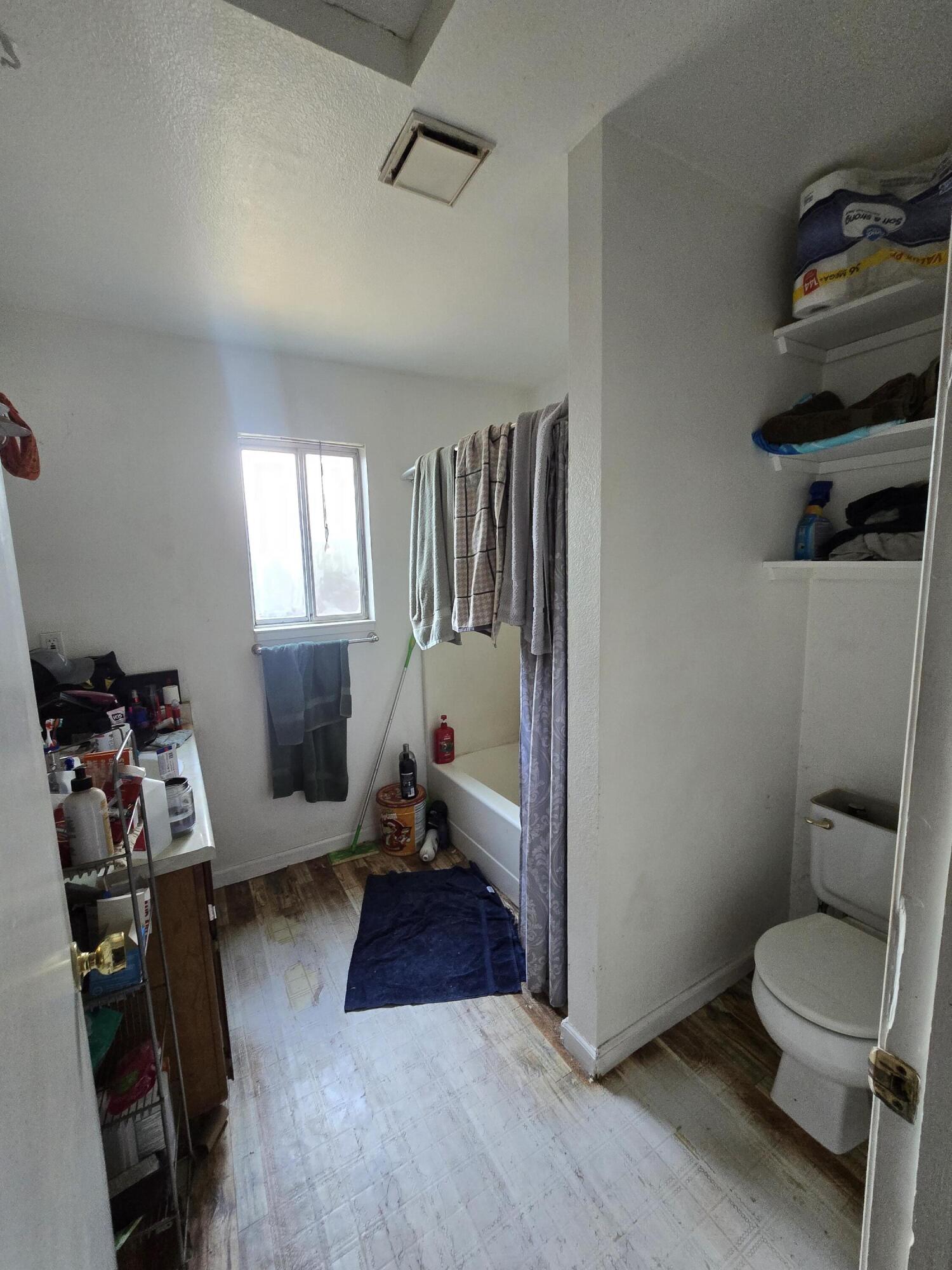 1591 Canby Road Redding, CA 96002 - Photo 11 of 15 a living room with furniture and a toilet
