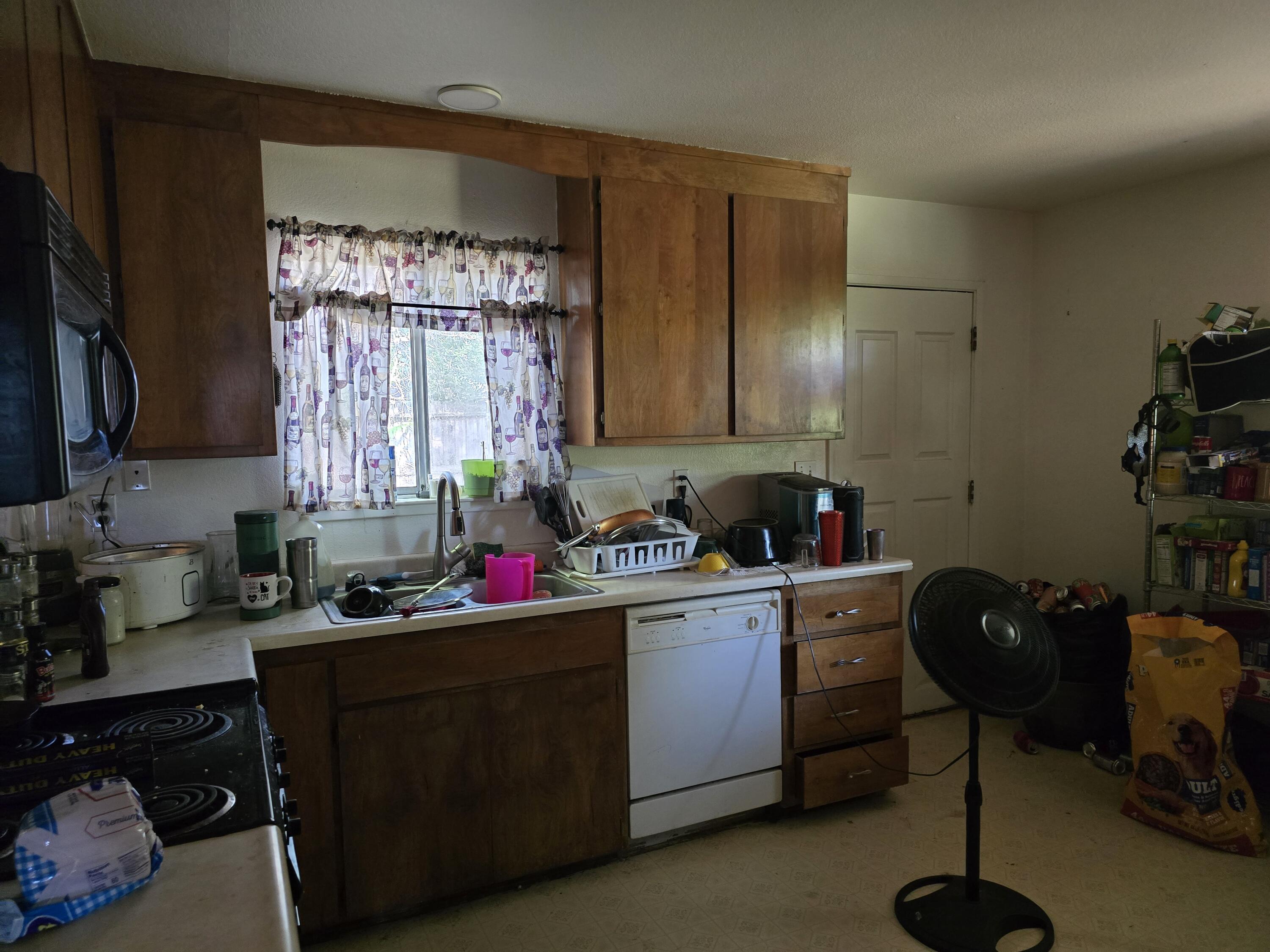 1591 Canby Road Redding, CA 96002 - Photo 3 of 15 a kitchen with a cabinets and furniture