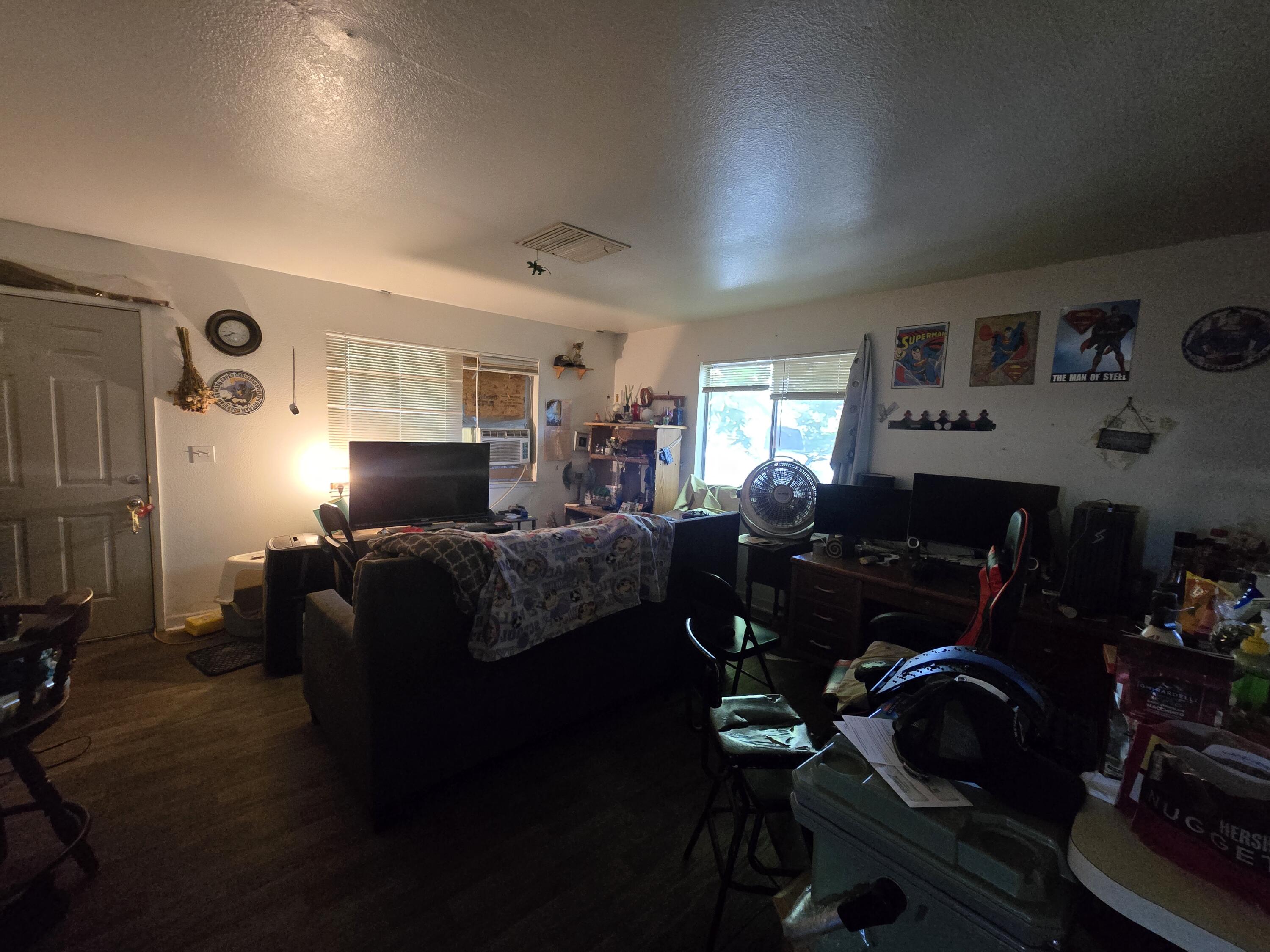 1591 Canby Road Redding, CA 96002 - Photo 9 of 15 a living room with furniture a lamp and a window
