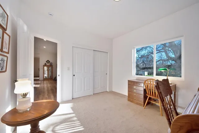 a living room with furniture a window and a table