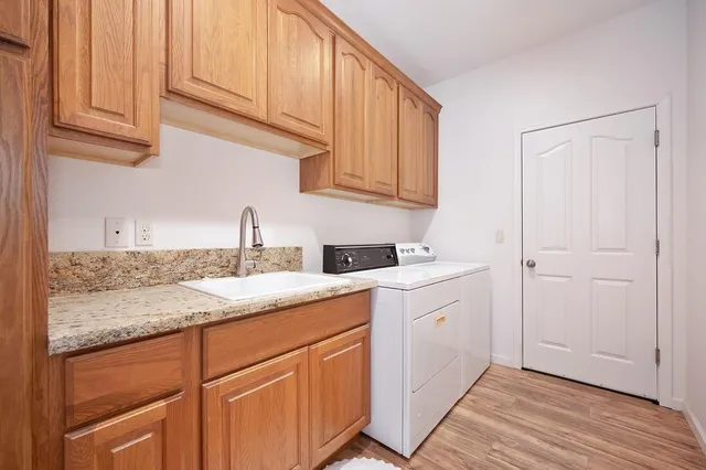 a kitchen with a sink and cabinets