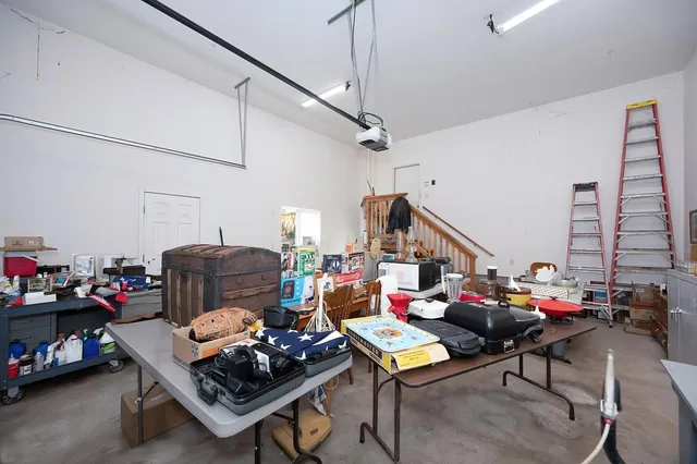 a living room with lots of furniture and a wooden floor