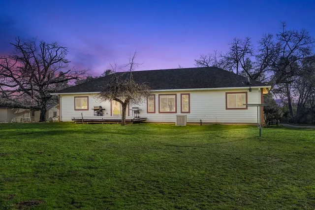 a view of a house with a big yard