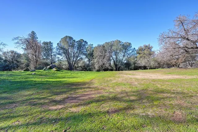 a view of a yard with sunset view
