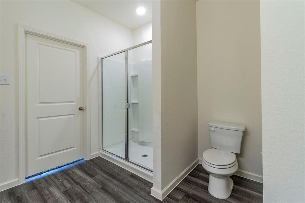 1848 McCree Street Forney, TX 75126 - Photo 10 of 33 Full bath with dark wood-style floors and a stall shower