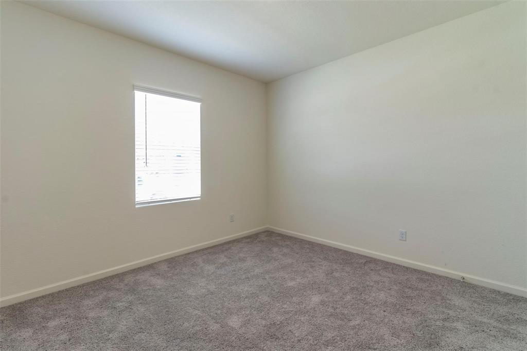 1848 McCree Street Forney, TX 75126 - Photo 12 of 33 an empty room with a window