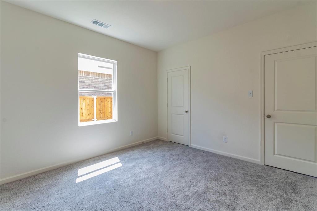1848 McCree Street Forney, TX 75126 - Photo 15 of 33 Carpeted spare room with baseboards