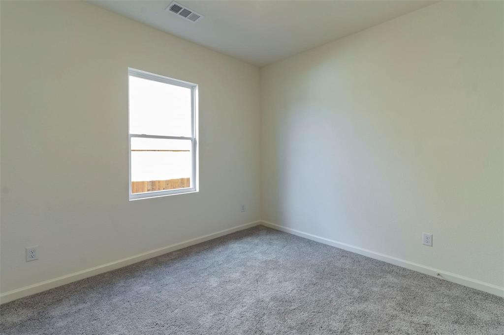 1848 McCree Street Forney, TX 75126 - Photo 17 of 33 an empty room with a window
