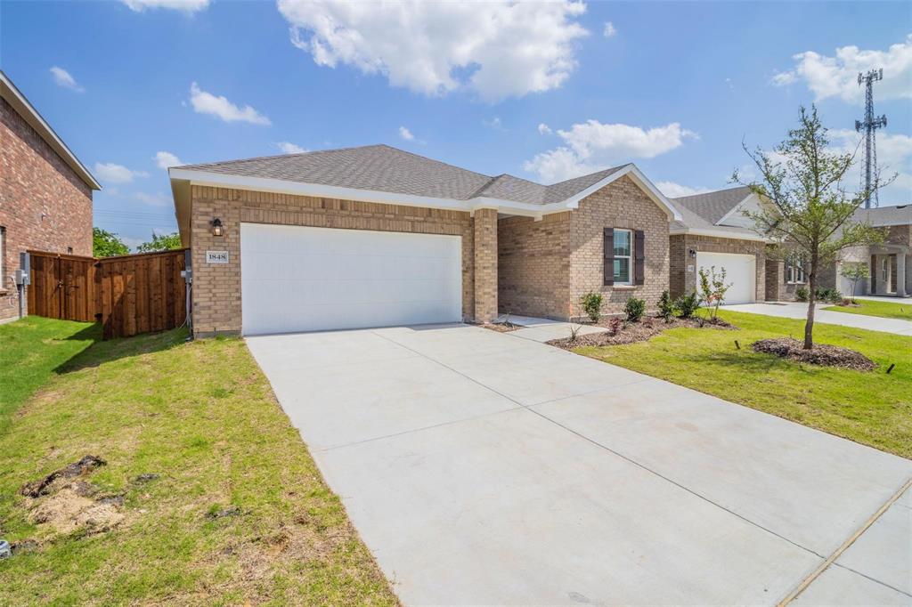 1848 McCree Street Forney, TX 75126 - Photo 18 of 33 Ranch-style home with brick siding, a shingled roof, concrete driveway, and a garage