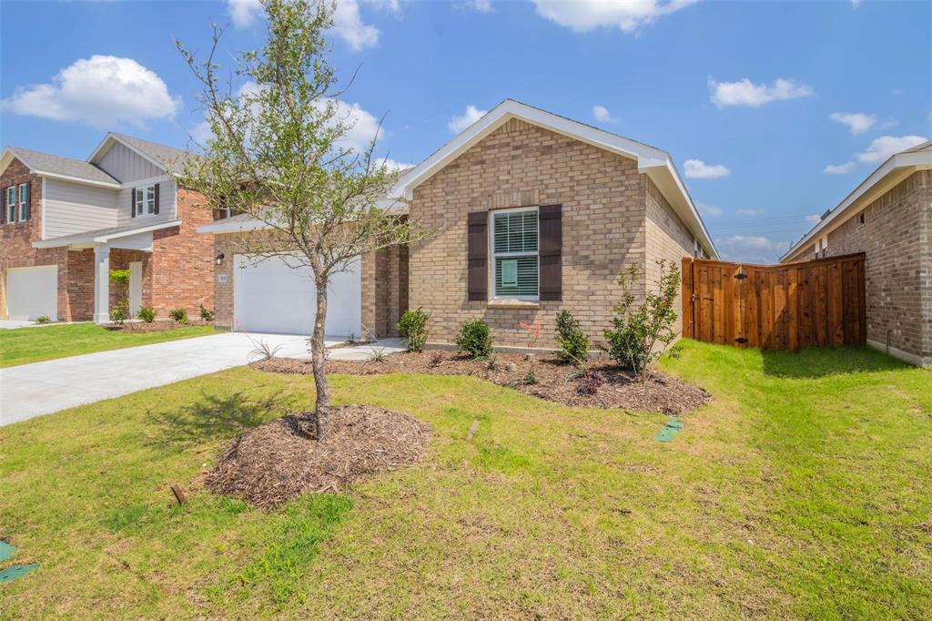 1848 McCree Street Forney, TX 75126 - Photo 19 of 33 View of front of house with driveway, an attached garage, and brick siding
