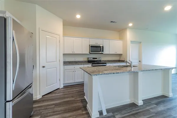 a view of a kitchen with a sink