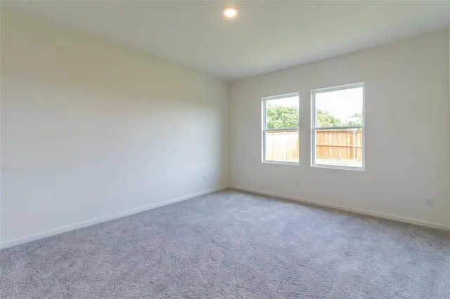 a kitchen with kitchen island granite countertop a refrigerator stove and microwave