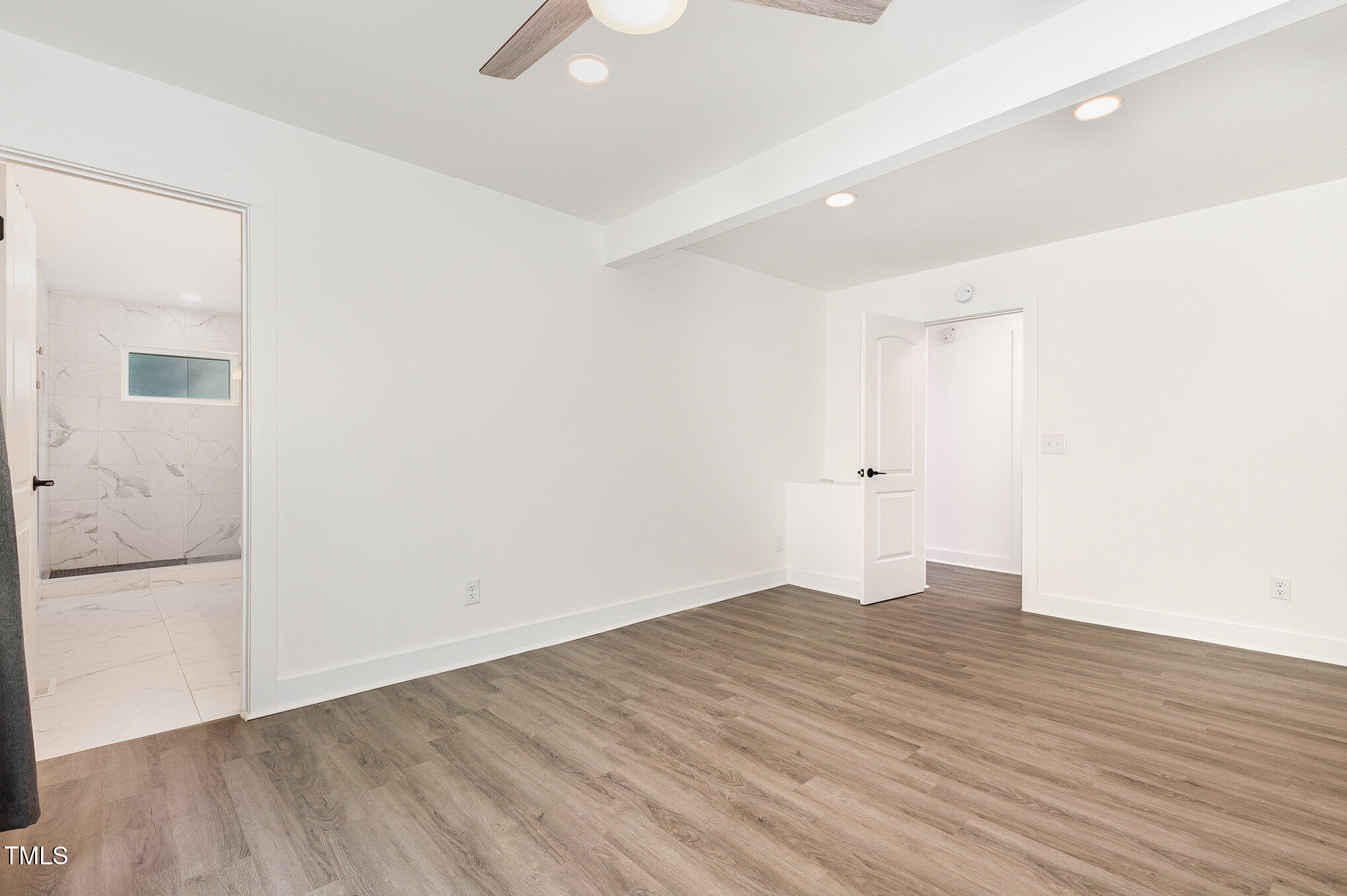 819 Cumberland Street Raleigh, NC 27610 - Photo 13 of 21 a view of an empty room with wooden floor