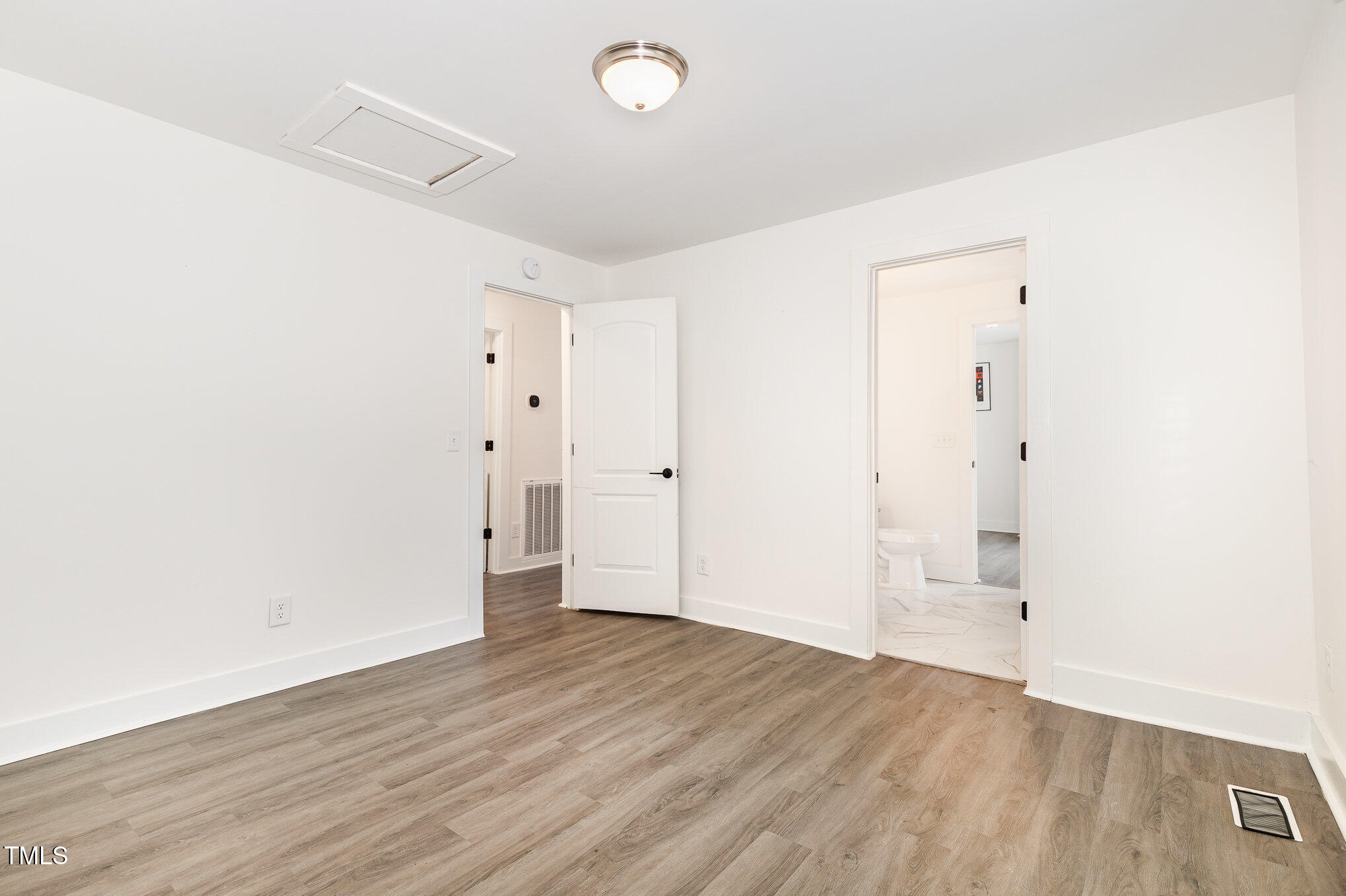 819 Cumberland Street Raleigh, NC 27610 - Photo 16 of 21 an empty room with wooden floor