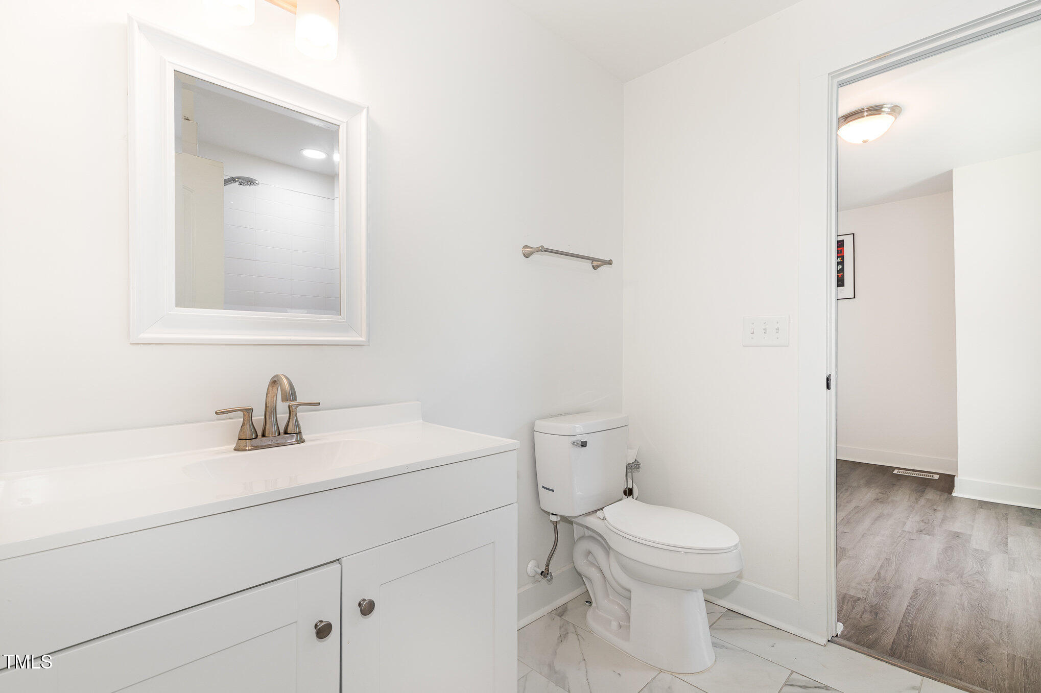819 Cumberland Street Raleigh, NC 27610 - Photo 19 of 21 a bathroom with a toilet a sink and mirror