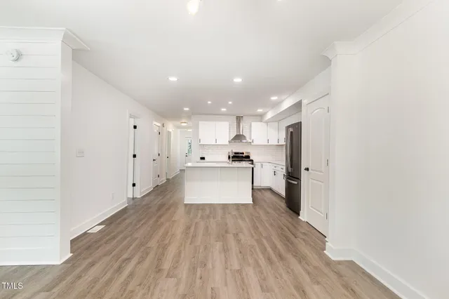 a view of kitchen with wooden floor